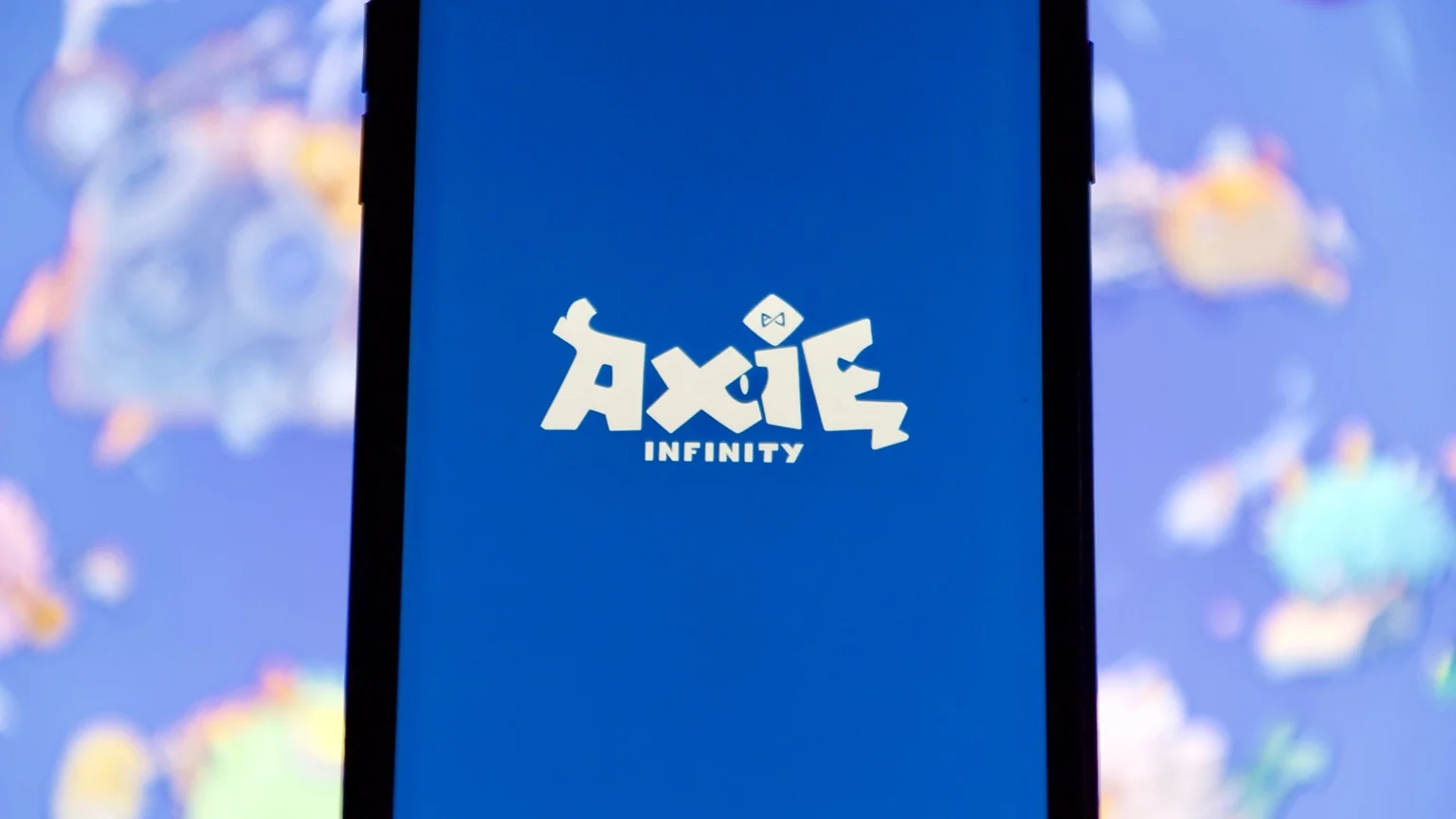 The Axie Infinity logo on a smart phone.