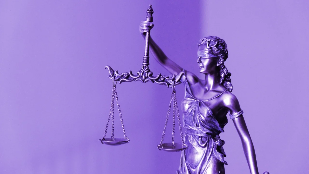 The scales of justice. Image: Tingey Law Firm on Unsplash.